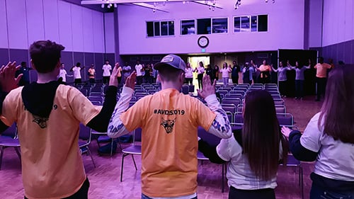 Center for Educator Support students standing together in a circle playing a game