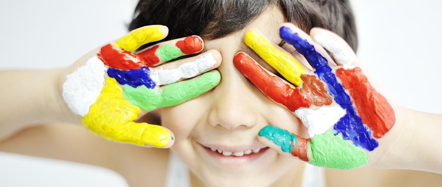 Child with paint on hands