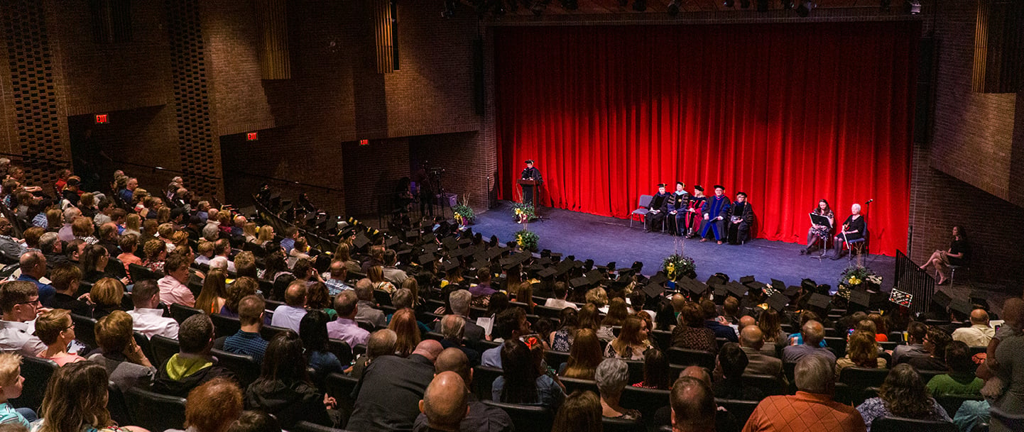 People gathered in Ostrander Auditorium for graduation ceremony